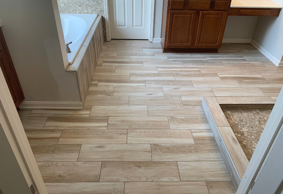 tile that looks like hardwood floor planks in a bathroom